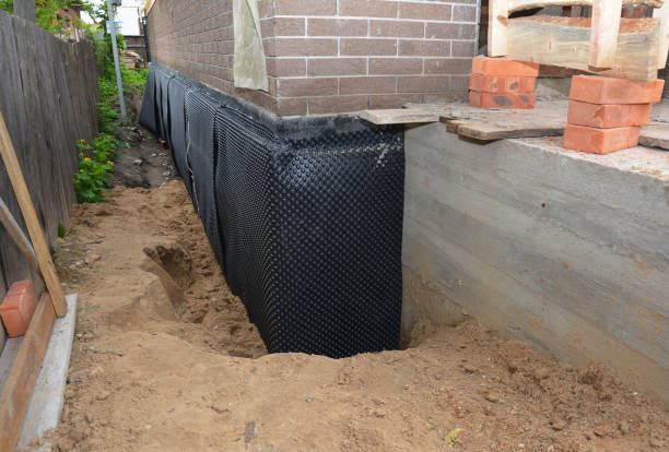 Happy homeowners after waterproofing job in Copiague